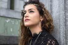 Load image into Gallery viewer, Stunning hoops made by hand. They reflect the light so beautifully and snazz up any outfit ! A little under 2 inches in diameter. Available in: Pure Sterling silver 14k gold fill earwire/ 14k gold plated jeweler's brass These high quality earrings do not tarnish and are great for most any skin type. Simple polishing cloth keeps them beautiful forever!