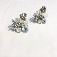 Load image into Gallery viewer, These delicate studs are perfect for any occasion. They sparkle in the sun or any light. Handmade from Swarovski Opals, rhinestones and genuine moonstones. Handmade with sterling silver wire and beautiful attention to design. Part of these earrings contain plated silver material.   About the size of a dime. Unique and pretty. Perfect for special occasions or everyday wear! Simple Elegance!  Comes in a very pretty box.
