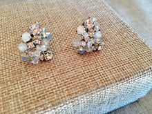 Load image into Gallery viewer, These delicate studs are perfect for any occasion. They sparkle in the sun or any light. Handmade from Swarovski Opals, rhinestones and genuine moonstones. Handmade with sterling silver wire and beautiful attention to design. Part of these earrings contain plated silver material.   About the size of a dime. Unique and pretty. Perfect for special occasions or everyday wear! Simple Elegance!  Comes in a very pretty box.

